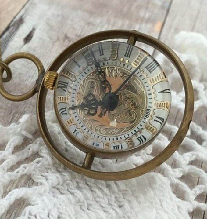 Round Brass Pocket Watch with rotating orb